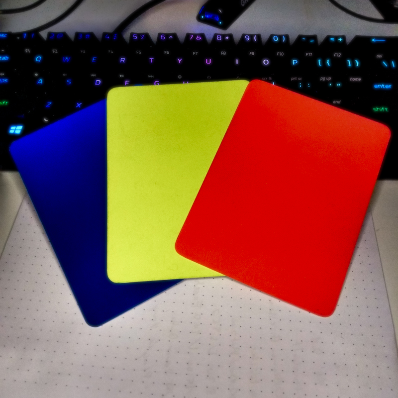A red, yellow and blue prnalty card.